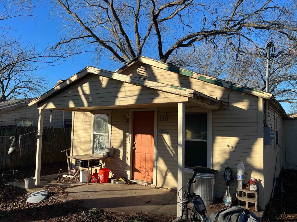 Front of a Burleson house that we bought for cash